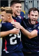  ??  ?? PARTY TIME: Ross County’s Marcus Fraser (centre) celebrates his winner