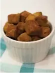  ??  ?? Crispy tofu cubes are marinated in tamari and apple cider vinegar, then coated in nutritiona­l yeast.