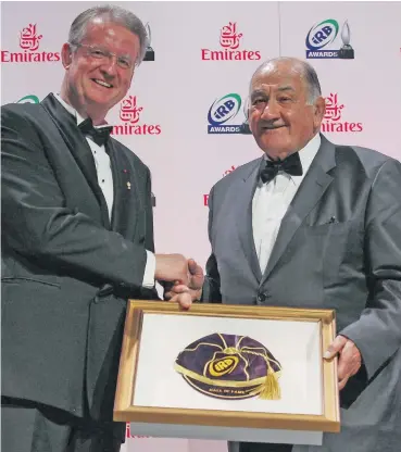  ?? Photo: ?? Hall of Fame Inductee the late Sir Nicolas Shehadie (right) receives his award from former World Rugby chairman Bernard Lapsset .