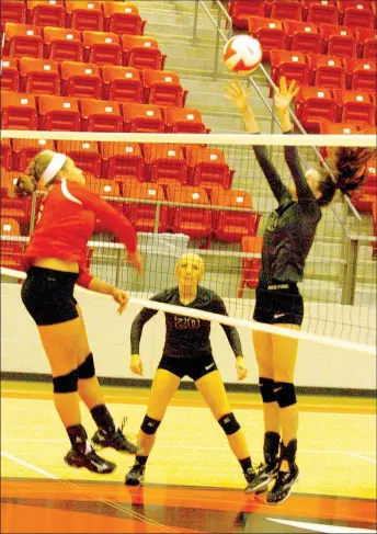  ?? MARK HUMPHREY ENTERPRISE-LEADER ?? Farmington senior Anna Dutton pounds a hit during an Oct. 6, 17-25, 25-21, 25-18, 25-19 victory over 5A West rival Alma. During state tourney play this week, the Lady Cardinals seek to regain momentum picked up during the match with Alma that sparked...