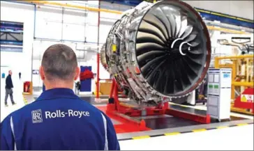  ?? PAUL ELLIS/AFP ?? A Rolls Royce Trent XWB engine is shown on the assembly line at the Rolls-Royce factory in Derby, central England, on November 30, 2016.