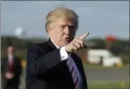  ?? EVAN VUCCI — ASSOCIATED PRESS ?? President Donald Trump gestures as he walks to board Air Force One to travel to Huntsville, Ala., for a campaign rally for Senate candidate Luther Strange, Friday in Morristown, N.J.