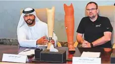  ?? Virendra Saklani/Gulf News ?? Fahd Mohammad Ali, who can now drive, with orthopaedi­c prosthetis­t Sebastian Giede at a press conference.