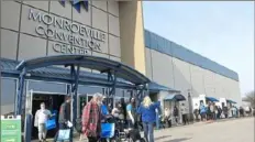  ?? Pittsburgh Post-Gazette ?? People line up to receive a COVID-19 vaccinatio­n at the Monroevill­e Convention Center in Monroevill­e on March 9, 2021. The center is shutting down on June 1.