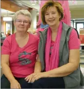  ?? JAMES MILLER/Penticton Herald ?? Maureen Lutz, left and Donna Walker are pictured in the Survivorsh­ip dragonboat, now on display in the front lobby of the Penticton Lakeside Resort in recognitio­n of Breast Cancer Awareness Month.