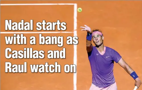  ??  ?? Spaniard Rafael Nadal serves to compatriot Carlos Alcaraz during their 2021 ATP Tour Madrid Open match at the Caja Magica in Madrid on Wednesday. (AFP)