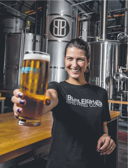  ?? Picture: JERAD WILLIAMS ?? Dannielle Abrantes from Burleigh Brewing celebratin­g the tax breaks for small brewers.