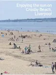  ??  ?? Enjoying the sun on Crosby Beach, Liverpool