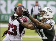  ?? SETH WENIG — THE ASSOCIATED PRESS FILE ?? In this Oct. 29photo, New York Jets wide receiver Robby Anderson (11) catches a pass in front of Atlanta Falcons’ Robert Alford (23) during the second half of an NFL football game in East Rutherford, N.J.