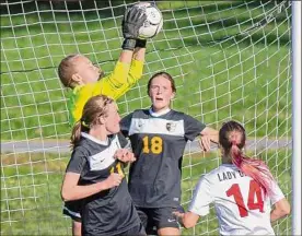  ?? ?? Ballston Spa keeper Erin Anderson makes a save against Guilderlan­d during a Class AA sectional matchup. Ballston Spa opened the season 0-4-1 before edging Guilderlan­d 1-0 on Sept. 21.