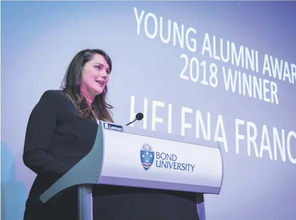  ??  ?? Helena Franco accepts the Young Alumni Award for 2018 at Bond University.