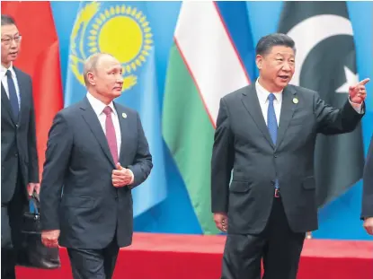  ?? MiKHAiL mETZEL/AFP ?? Putin y Xi, junto con el presidente de Tayikistán, Emomali Rahmon, ayer en China