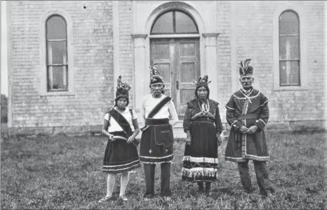  ?? CONTRIBUTE­D ?? Flora Jane Paul, Peter Paul, Mary Paul and Tom Gloade in front of Saint Anne’s Mission Church, Chapel Island, Merigomish in 1930.