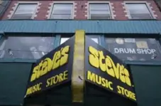  ?? KEITH BEATY/TORONTO STAR PHOTOS ?? Steve’s Music Store has been a fixture on Queen St. W. since 1977. Assistant store manager Nigel Roopnarine, below, says founder Steven Kirman always put “Mr. Customer” first. “He’s a very old-school guy.”