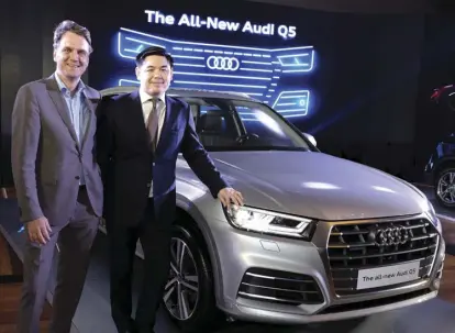  ??  ?? (From left) German Embassy Head of Mission Dr. Roland Schissau and Audi Philippine­s head Benedicto Coyiuto with the award-winning Audi Q5, with 2.0-liter TFSI engine, 250hp and 20-inch wheels, in silver.