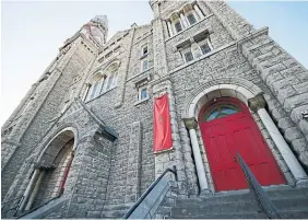  ?? BLAIR GABLE FOR THE TORONTO STAR ?? A red banner featuring The United People of Canada’s logo hangs outside a deconsecra­ted church in downtown Ottawa. Several members of the group’s board are suspected to have ties to the so-called “Freedom Convoy” protests.