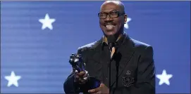  ??  ?? Eddie Murphy accepts the lifetime achievemen­t award at the 25th annual Critics’ Choice Awards in Santa Monica, Calif., on Jan. 12, 2020.