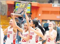  ??  ?? Carrothers (14), Alyna Santiago (22), McKayla Henry (30) and Mia Depta (12) celebrate Crown Point’s 54-45 win against Penn in the Class 4A LaPorte Regional final on Feb. 13.