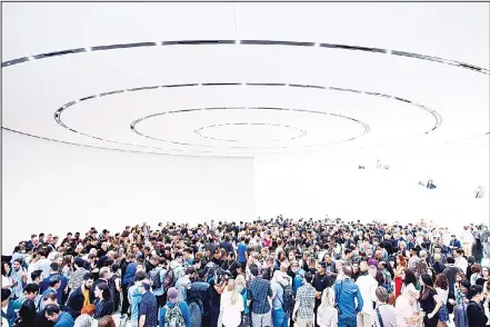  ??  ?? In this file photo taken on Sept 12, 2018 attendees gather for a product launch event at Apple’s Steve Jobs Theater in Cupertino, California. A Chinese court ordered a ban in the country on iPhone sales in a patent dispute between US chipmaker Qualcomm and Apple, according to aQualcomm statement on Dec 10, 2018. (AFP)