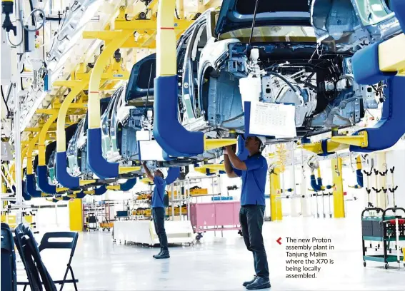  ??  ?? The new Proton assembly plant in Tanjung malim where the X70 is being locally assembled.