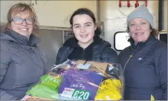  ?? John Ahern) ?? NICE WIN FOR OLIVIA: Olivia Mee, winner of the Araglin Pony Club luxury hamper at last Saturday’s point-to-points, receiving her prize from pony club officers, Mary Leddy (left) and Paula O’Donovan. (Pic: