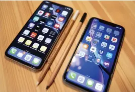  ??  ?? The 6.5-inch iphone XS Max (left) is quite a bit bigger than the 6.1inch iphone XR.