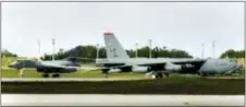  ?? MASAKO WATANABE — PACIFIC DAILY NEWS VIA AP, FILE ?? In this file photo, a B-1B Lancer bomber, left, taxies past a B-52 shortly after landing at Andersen Air Force Base in Guam. The small U.S. territory of Guam has become a focal point after North Korea’s army threatened to use ballistic missiles to...