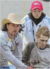  ?? STAFF FILE PHOTO, ABOVE, BY STUART CAHILL; BELOW, BY MATT STONE; STAFF PHOTO, RIGHT, BY JIM MAHONEY ?? ONE STEP AT A TIME: Marathon bombing survivor Jeff Bauman, seen above on the fateful day with hero Carlos Arredondo, is battling back, right, after losing both legs. Bauman, seen below with actor Jake Gyllenhaal, will have his story told in the...