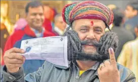  ?? PTI ?? Girdhar Vyas, who claims to sport the longest moustache in the world, after casting his vote in assembly elections, in Bikaner, Rajasthan, on Friday.