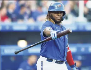  ?? Joshua Bessex / Associated Press ?? The Toronto Blue Jays’ Vladimir Guerrero Jr. points to the visiting dugout before his at bat during the first inning against the Boston Red Sox on Wednesday in Buffalo, N.Y.