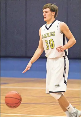  ??  ?? Oakwood Christian senior John Jacob McSpadden hit a nearly full-court buzzer beater to send the Eagles to a 48-47 road win at Mountain View Christian last Tuesday. (File photo by Scott Herpst)