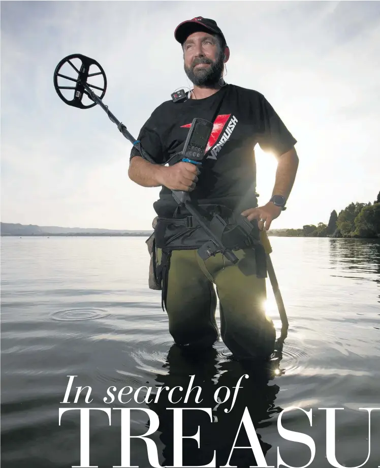  ?? PHOTO / ALAN GIBSON ?? Gary Coker seeks metal in the shallows of Lake Rotorua.