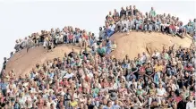  ?? ?? PEOPLE gather at the ‘Hill of Horror’ during a memorial service for miners killed during clashes at Lonmin’s Marikana platinum mine in Rustenburg, in August 2012. | REUTERS