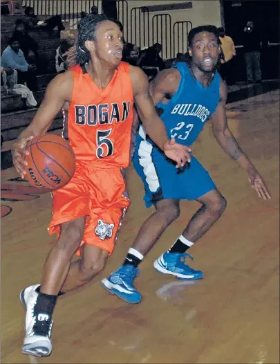  ??  ?? Bogan guard Juwan Henry drives past Riverside-Brookfield’s Damonta Henry.
| STACIA TIMONERE~FOR SUN-TIMES MEDIA