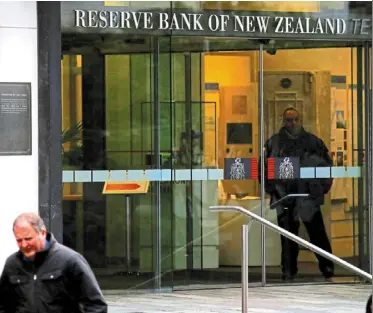  ?? — Reuters ?? Change of heart: The main entrance to the reserve Bank of New Zealand in central Wellington. Most economists are joining ANZ Bank and Westpac in predicting the RBNZ will
nd delay pivoting until next year.