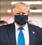  ?? Alex Edelman / AFP via Getty Images ?? President Donald Trump wears a mask as he visits Walter Reed National Military Medical Center in Bethesda, Md., on Saturday.