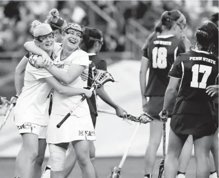  ?? ELISE AMENDOLA/ASSOCIATED PRESS ?? Maryland's Megan Whittle, front right, celebrates her goal with teammate Caroline Steele during the second half of the Terps’ semifinal victory over Penn State on Friday.