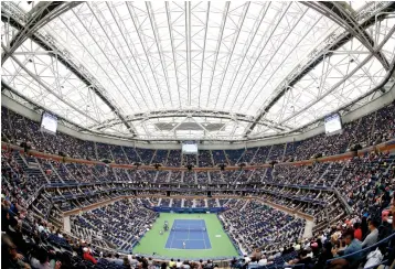  ?? Associated Press file photo ?? ■ Fans fill the stands Sept. 6, 2017, at Arthur Ashe stadium as Karolina Pliskova of Czech Republic plays CoCo Vandeweghe of the United States, during the U.S. Open quarterfin­als in New York.