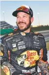  ?? THE ASSOCIATED PRESS ?? Martin Truex Jr. smiles after winning the pole for today’s NASCAR Cup Series race at Kansas Speedway on Friday.