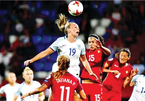  ?? — AFP photo ?? England's forward Toni Duggan (L) and Portugal's defender Carole Costa head the ball during the UEFA Women's Euro 2017 football match between Portugal and England at Stadium Koning Willem II in Tilburg on July 27, 2017.
