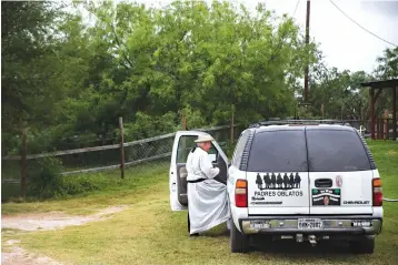  ?? Ryan Michalesko/The Dallas Morning News via AP ?? ■ Father Roy Snipes climbs into his white Chevy Suburban on May 3 after a boat ride on the Rio Grande River near Mission, Texas.