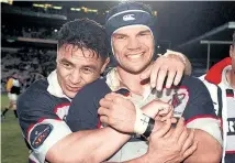  ?? Picture / Photosport ?? When winners were grinners . . . Michael Jones and Eroni Clarke after winning the NPC title with Auckland in 1999.
