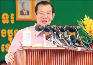  ?? FACEBOOK ?? Prime Minister Hun Sen speaks to garment workers yesterday in Phnom Penh, where he referred to effigyburn­ing protesters in Australia as ‘dogs’.