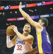  ?? Gary Coronado Los Angeles Times ?? MORE THAN 40 firms have expressed preliminar­y interest in the Fox networks. Above, a Clippers game.