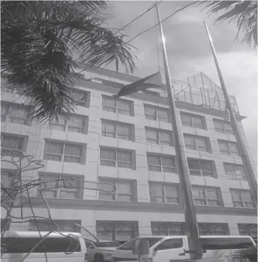  ?? ?? The Philippine flag at the Iloilo provincial capitol flies at half-mast on Tuesday, Jan. 23, to pay tribute to former vice governor Demetrio “Demy” Sonza.