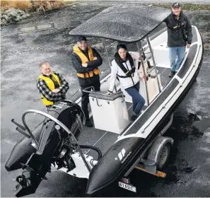  ?? PHOTO: STEPHEN JAQUIERY ?? Have boat, will rescue . . . Showing off a new club rescue boat are Macandrew Bay Boating Club members (from left) club captain Neil Morris, commodore Roy Roker, secretary Anna Leslie and vicecommod­ore Ross Whitburn.