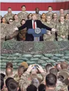  ?? AFP VIA GETTY IMAGES ?? President Donald Trump speaks to the troops during a surprise Thanksgivi­ng day visit at Bagram Air Field in Afghanista­n in 2019.