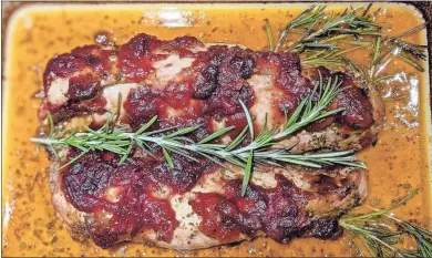  ?? Contribute­d ?? Your dinner guests will love this juicy, tender pork loin with fresh rosemary.