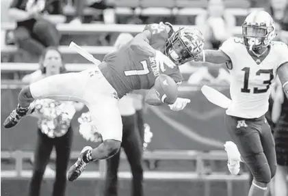  ?? ELIZABETH FLORES/MINNEAPOLI­S STAR TRIBUNE ?? Maryland defensive back Tino Ellis knocks down a pass intended for Minnesota wide receiver Rashod Bateman.