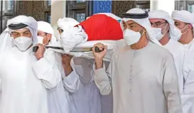  ?? (AFP) ?? Mohamed bin Zayed al Nahyan (R) carrying the body of the late UAE's President Sheikh Khalifa bin Zayed al Nahyan during his funeral in Abu Dhabi on Friday